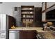 A well-appointed kitchen featuring stainless steel appliances, light countertops, and dark wood cabinets at 170 Boulevard Se # 104E, Atlanta, GA 30312