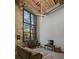 Spacious living room featuring exposed brick, high ceilings, and a large window providing ample natural light at 170 Boulevard Se # 104E, Atlanta, GA 30312