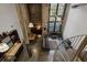 Open floor plan with exposed brick, industrial beams, and an abundance of natural light from large windows at 170 Boulevard Se # 104E, Atlanta, GA 30312