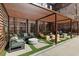 Outdoor lounge area with modern furnishings, a pergola, and artificial turf accents at 170 Boulevard Se # 104E, Atlanta, GA 30312