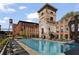 Community pool surrounded by lounge chairs and historic brick buildings against a bright sky at 170 Boulevard Se # 104E, Atlanta, GA 30312
