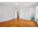 Bright bedroom boasts gleaming hardwood floors and an attached bathroom for added convenience at 2696 Dodson Dr, East Point, GA 30344