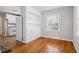 Bright dining room features hardwood floors, built-in shelving, and a view from the window at 2696 Dodson Dr, East Point, GA 30344