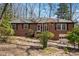 Charming brick ranch with mature trees, offering classic style and curb appeal at 2696 Dodson Dr, East Point, GA 30344