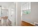 Hallway featuring hardwood floors, neutral walls and an open archway at 2696 Dodson Dr, East Point, GA 30344