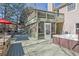 Spacious two-level deck with a hot tub, screened-in porch, stone kitchen, and outdoor seating at 3222 Pagoda Trce, Lawrenceville, GA 30043