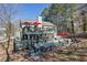 Exterior view of multi-level backyard deck with outdoor kitchen, picnic table, and screened-in porch at 3222 Pagoda Trce, Lawrenceville, GA 30043