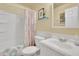 This bathroom features a shower/tub combination, a vanity, and decorative touches at 3222 Pagoda Trce, Lawrenceville, GA 30043