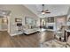 Bright living room with neutral colors, a ceiling fan, and a fireplace at 3222 Pagoda Trce, Lawrenceville, GA 30043