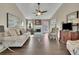 Comfortable living room with fireplace, neutral color scheme, and ample natural light at 3222 Pagoda Trce, Lawrenceville, GA 30043
