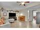Open living room with large TV, piano, and access to other rooms, offers ample space for entertaining at 3222 Pagoda Trce, Lawrenceville, GA 30043