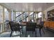 Screened porch with a dining table, perfect for outdoor meals and gatherings at 3222 Pagoda Trce, Lawrenceville, GA 30043