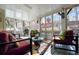 Cozy sunroom with comfortable seating, screened windows, and decorative accents at 3222 Pagoda Trce, Lawrenceville, GA 30043