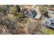 Overhead view of the home, driveway, and the surrounding landscape, perfect for buyers seeking privacy at 7025 Bavarian Wood Pl, Buford, GA 30518