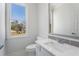 Charming bathroom showcasing a modern sink, toilet, and a window offering natural light in a comfortably designed space at 7025 Bavarian Wood Pl, Buford, GA 30518