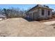 Spacious concrete driveway leading to a two-car garage in a well-kept home with mature trees at 7025 Bavarian Wood Pl, Buford, GA 30518