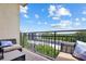Balcony with comfortable seating and a beautiful view of the surrounding landscape at 711 Cosmopolitan Ne Dr # 523, Atlanta, GA 30324