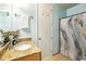 Well-maintained bathroom with a single sink, decorative shower curtain, and good lighting at 711 Cosmopolitan Ne Dr # 523, Atlanta, GA 30324