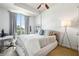 Bright bedroom with natural light, a modern desk, and comfortable sleeping space at 711 Cosmopolitan Ne Dr # 523, Atlanta, GA 30324