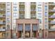 Low angle exterior showcasing the building's balconies and entrance, highlighting architectural details at 711 Cosmopolitan Ne Dr # 523, Atlanta, GA 30324