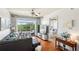 Bright living room with hardwood floors, balcony access, and an inviting open layout, perfect for relaxation at 711 Cosmopolitan Ne Dr # 523, Atlanta, GA 30324