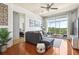 Living room with hardwood floors, balcony access, and neutral decor, creating a welcoming atmosphere at 711 Cosmopolitan Ne Dr # 523, Atlanta, GA 30324