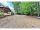Expansive backyard with mature trees, perfect for outdoor activities and relaxation at 10835 Tuxford Dr, Alpharetta, GA 30022