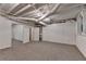 Spacious basement with exposed white ceiling and carpet flooring offering great potential at 10835 Tuxford Dr, Alpharetta, GA 30022