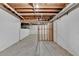 Unfinished basement space ready for customization with exposed ceiling and concrete floor at 10835 Tuxford Dr, Alpharetta, GA 30022
