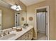 Bathroom featuring double sinks, large mirror, and a shower-tub combo, creating a functional and stylish space at 10835 Tuxford Dr, Alpharetta, GA 30022