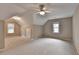 Spacious carpeted bedroom with vaulted ceiling, windows, and ceiling fan providing ample natural light and comfort at 10835 Tuxford Dr, Alpharetta, GA 30022