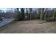 Image capturing the backyard with a lot of space and trees, illustrating the outdoor potential of the property at 2572 Tyler Way, Decatur, GA 30032