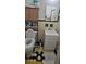 Neat bathroom with a vanity, toilet, and wall cabinet for storage at 2572 Tyler Way, Decatur, GA 30032