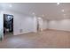 Large basement with recessed lighting and access to stairs at 585 Sherwood Ne Rd, Atlanta, GA 30324