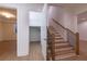 Finished basement with light-colored wood flooring and a staircase leading to another room at 585 Sherwood Ne Rd, Atlanta, GA 30324