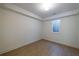 Finished basement with light-colored wood flooring and a window letting in natural light at 585 Sherwood Ne Rd, Atlanta, GA 30324