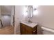 Elegant half bath featuring a modern mirror and a stylish marble vanity top at 585 Sherwood Ne Rd, Atlanta, GA 30324