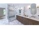 This spacious bathroom features a glass shower, double sinks, and stylish fixtures at 585 Sherwood Ne Rd, Atlanta, GA 30324