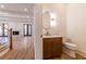 Stylish half bathroom featuring modern fixtures, marble vanity top, and hardwood floors at 585 Sherwood Ne Rd, Atlanta, GA 30324