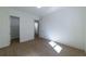 A bright bedroom featuring light-colored wood flooring and doorways leading to other rooms at 585 Sherwood Ne Rd, Atlanta, GA 30324