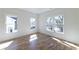 Bright bedroom with large windows, hardwood floors, and white trim details at 585 Sherwood Ne Rd, Atlanta, GA 30324