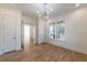 Bedroom featuring modern lighting, hardwood floors, and doorways leading to other rooms at 585 Sherwood Ne Rd, Atlanta, GA 30324