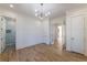 Bright bedroom with hardwood floors and modern lighting, offering a serene and inviting space at 585 Sherwood Ne Rd, Atlanta, GA 30324