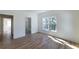 Bright bedroom with large windows, hardwood floors, and white trim details at 585 Sherwood Ne Rd, Atlanta, GA 30324