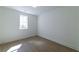 Bright bedroom with light-colored wood flooring and a window letting in natural light at 585 Sherwood Ne Rd, Atlanta, GA 30324