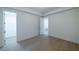 Bedroom with wood flooring, walk-in closet, and doors leading to other rooms at 585 Sherwood Ne Rd, Atlanta, GA 30324
