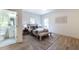 Cozy bedroom features hardwood floors, a neutral color scheme, and an en-suite bathroom at 585 Sherwood Ne Rd, Atlanta, GA 30324