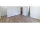 Bedroom with hardwood floors and multiple door openings to hallway at 585 Sherwood Ne Rd, Atlanta, GA 30324