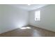 Bright bedroom with light-colored wood flooring and a window letting in natural light at 585 Sherwood Ne Rd, Atlanta, GA 30324