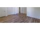 An unfurnished bedroom provides ample space and natural light with a smooth hardwood floor at 585 Sherwood Ne Rd, Atlanta, GA 30324